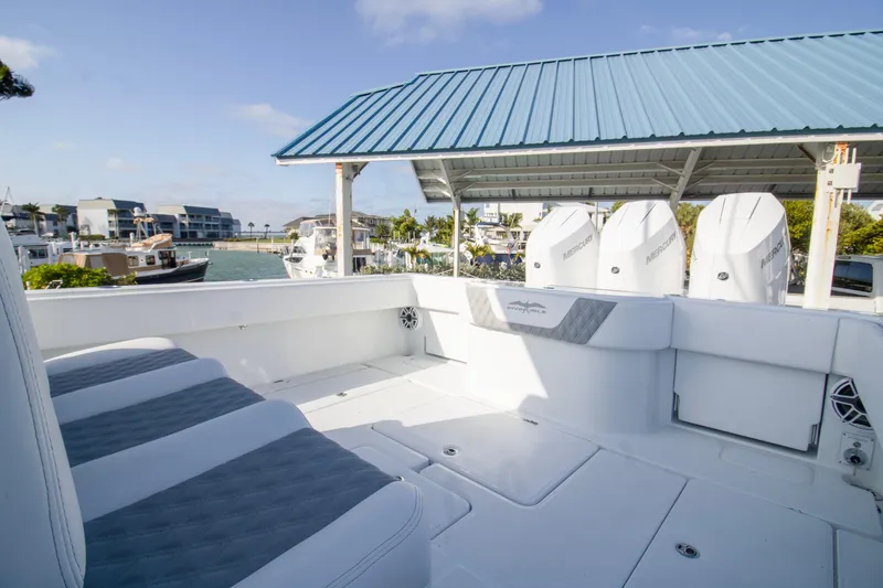  Yacht Photos Pics 2026 Invincible 39 Open Fisherman boat with Mercury engines docked at marina.