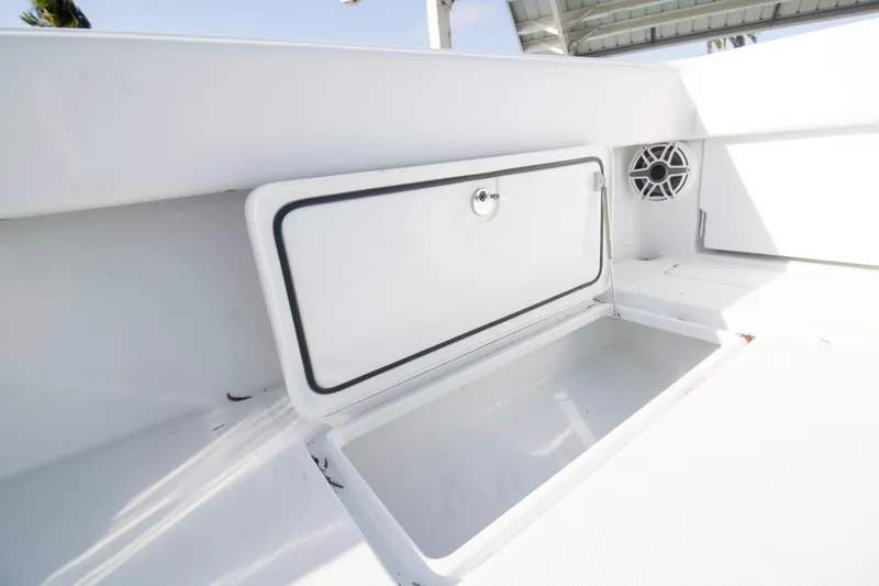  Yacht Photos Pics 2026 Invincible 39 Open Fisherman boat storage compartment with speaker detail.
