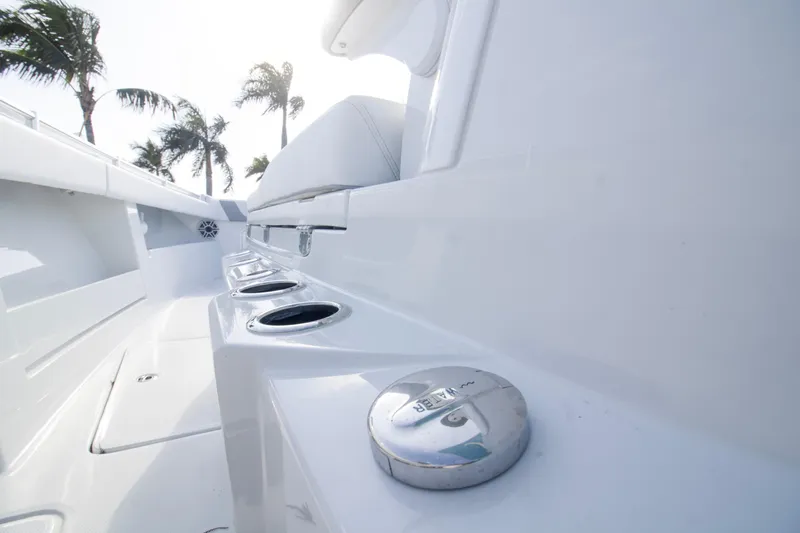  Yacht Photos Pics 2026 Invincible 39 Open Fisherman boat deck with palm trees in background.