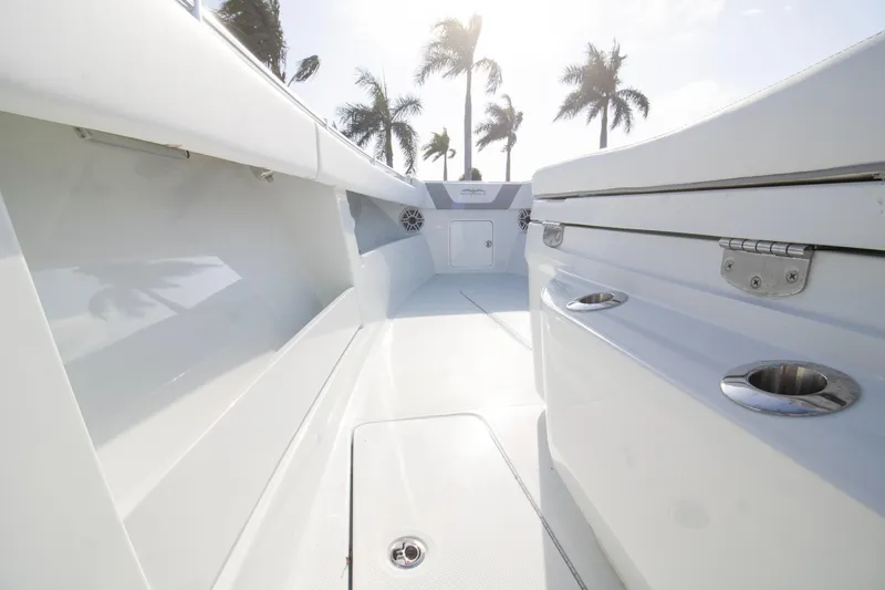 Yacht Photos Pics 2026 Invincible 39 Open Fisherman boat interior with sleek design and palm trees in background.