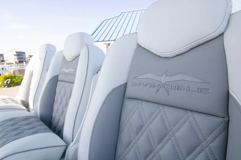  Yacht Photos Pics Luxury seating on 2026 Invincible 39 Open Fisherman boat, featuring elegant stitching and branding.