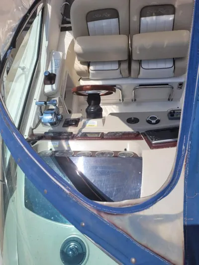 Knot On Call Yacht Photos Pics Interior view of 2013 Sea Ray Sundancer 370 boat cockpit with dual seats and control panel.