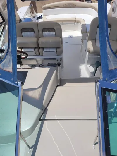 Knot On Call Yacht Photos Pics 2013 Sea Ray Sundancer 370 interior with seating and helm, showcasing luxury boat design.