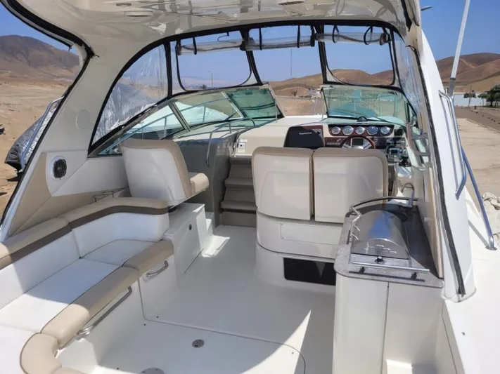 Knot On Call Yacht Photos Pics 2013 Sea Ray Sundancer 370 interior with beige seating and modern dashboard.