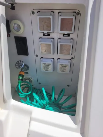 Knot On Call Yacht Photos Pics Electrical panel and hose storage on 2013 Sea Ray Sundancer 370 boat.