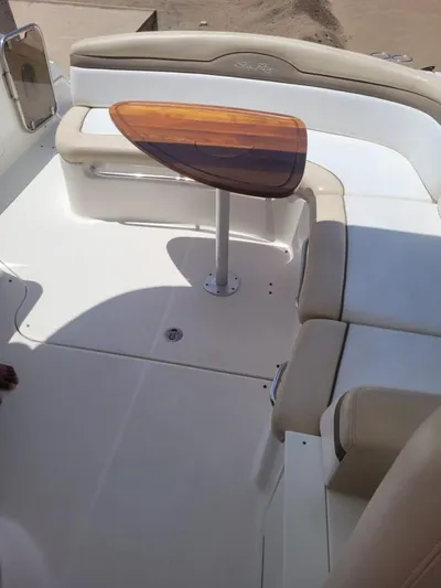 Knot On Call Yacht Photos Pics 2013 Sea Ray Sundancer 370 interior with seating and wooden table.