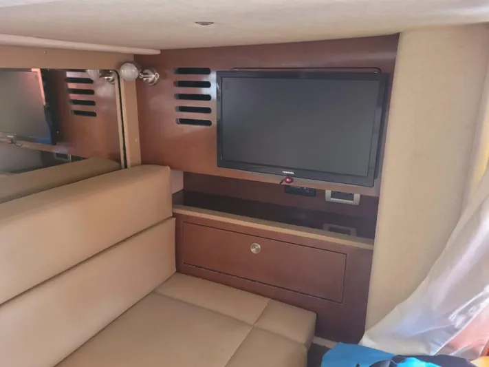 Knot On Call Yacht Photos Pics Interior of 2013 Sea Ray Sundancer 370 with TV and seating area.