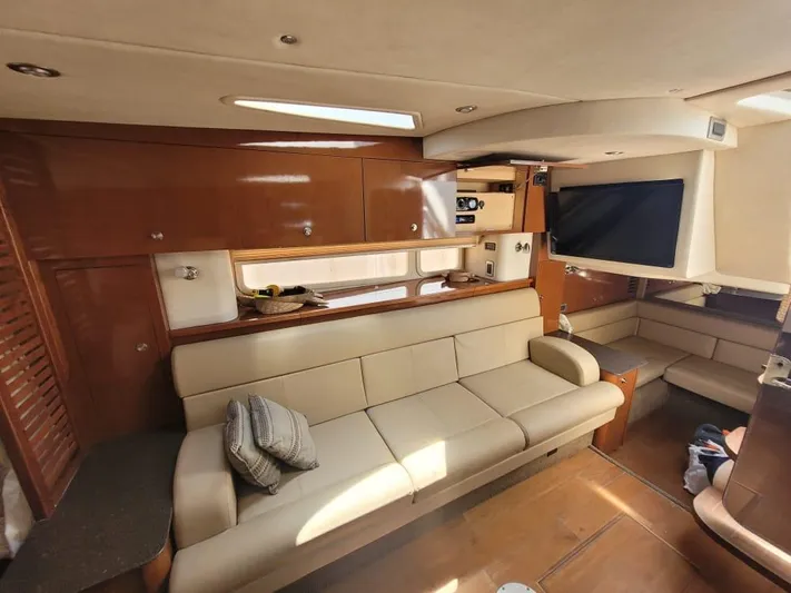 Knot On Call Yacht Photos Pics Luxurious interior of 2013 Sea Ray Sundancer 370 yacht with leather seating and TV.