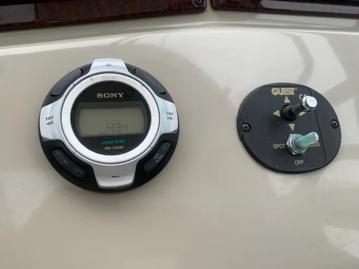 Knot On Call Yacht Photos Pics Control panel of a 2013 Sea Ray Sundancer 370 with Sony audio system and spotlight controls.