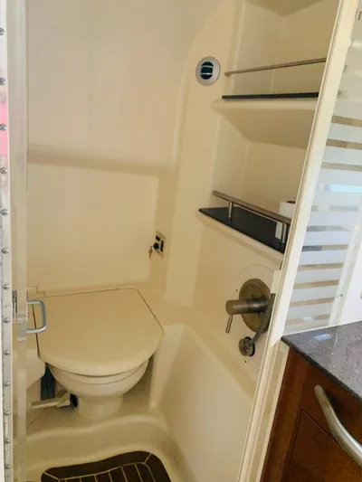 Knot On Call Yacht Photos Pics Compact bathroom in 2013 Sea Ray Sundancer 370 yacht with toilet and shower.