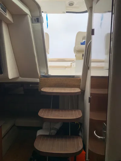 Knot On Call Yacht Photos Pics Interior view of 2013 Sea Ray Sundancer 370 yacht with wooden steps leading to deck.