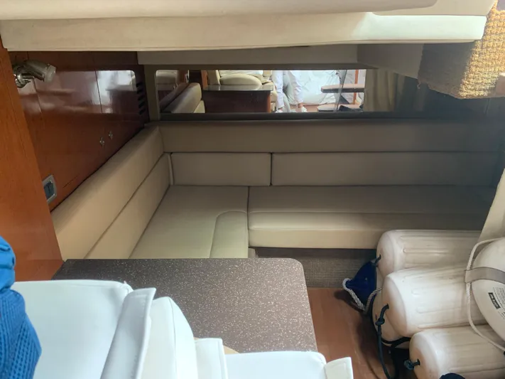 Knot On Call Yacht Photos Pics 2013 Sea Ray Sundancer 370 interior with beige seating and wooden accents.