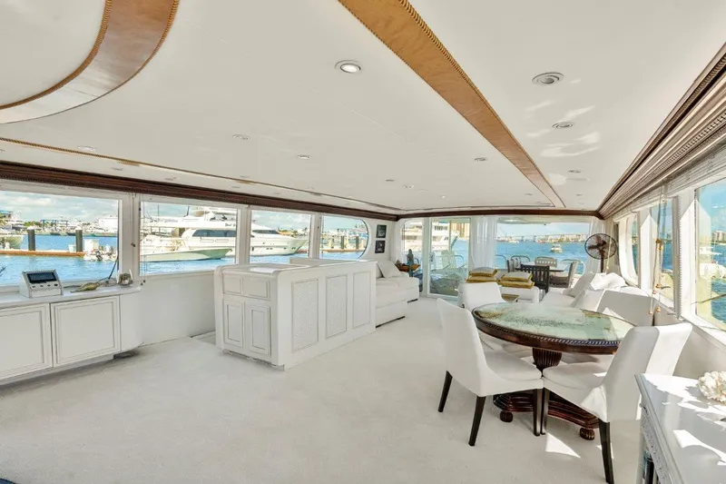 Envision Yacht Photos Pics Luxurious interior of 1984 Broward 110 Motor Yacht with elegant furnishings and panoramic windows.