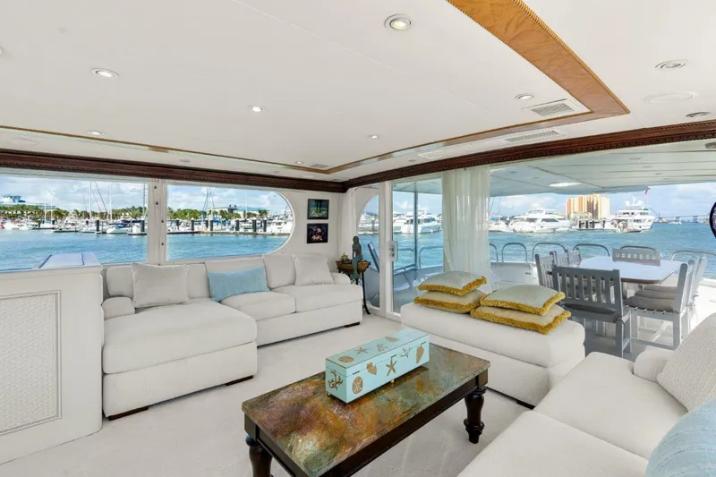 Envision Yacht Photos Pics Luxurious interior of 1984 Broward 110 Motor Yacht with waterfront view.