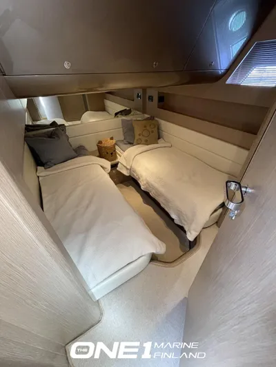  Yacht Photos Pics Luxurious cabin interior of 2007 Riva Rivale 52 yacht with twin beds and modern decor.