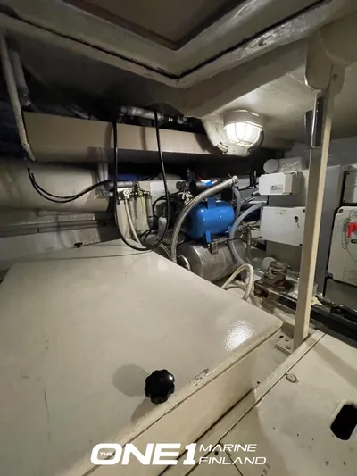  Yacht Photos Pics Engine room of a 2007 Riva Rivale 52 yacht, featuring mechanical components and wiring.