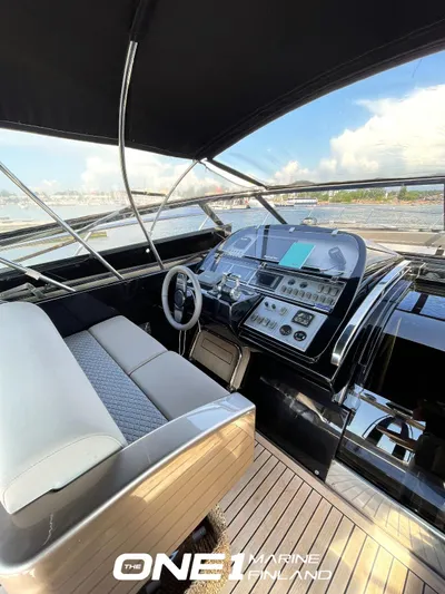  Yacht Photos Pics 2007 Riva Rivale 52 yacht cockpit with modern controls and seating.
