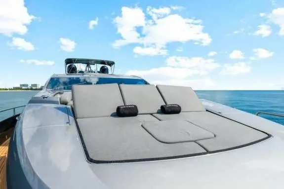  Yacht Photos Pics Sunseeker Predator 84 yacht, 2010 model, with sunbathing deck on a clear day.