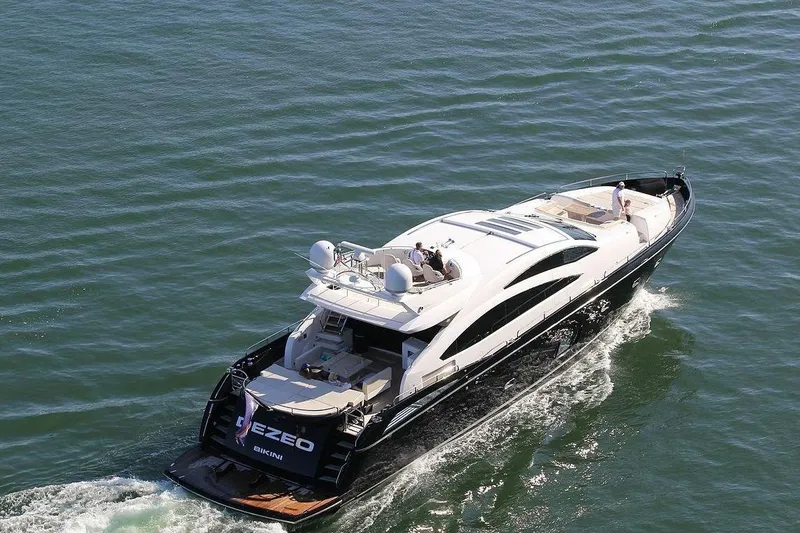  Yacht Photos Pics 2010 Sunseeker Predator 84 yacht cruising on open water, aerial view.