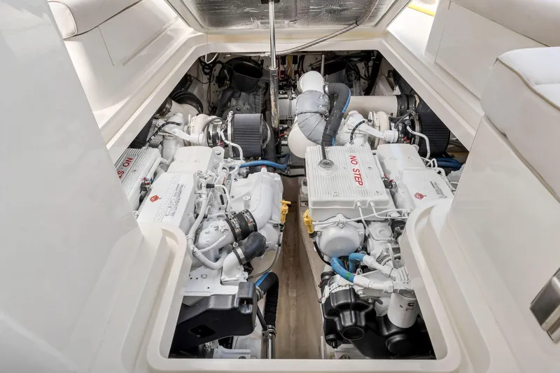 Wren Yacht Photos Pics Engine room of 2015 Hinckley Talaria 43 Motoryacht, showcasing dual engines and mechanical components.