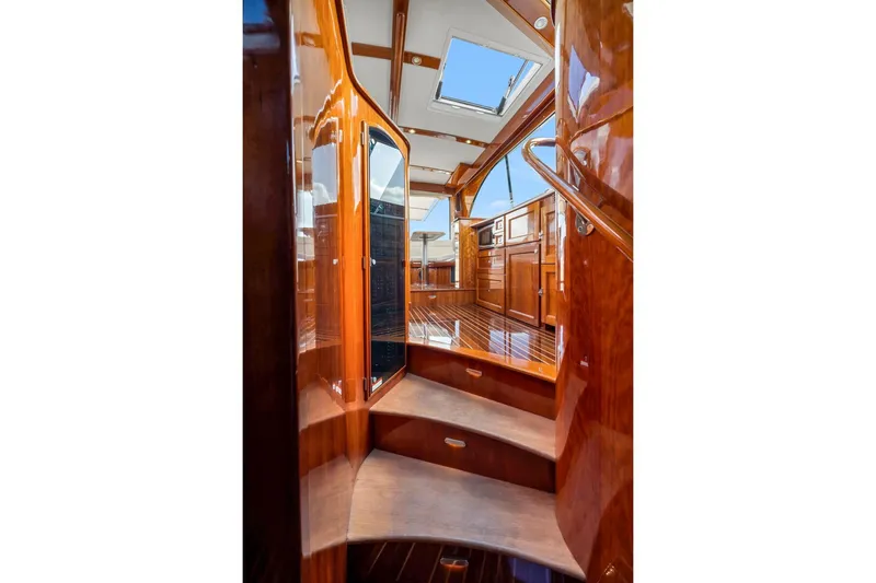 Wren Yacht Photos Pics Luxurious interior of 2015 Hinckley Talaria 43 Motoryacht with polished wood finish.