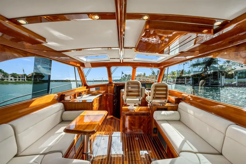Wren Yacht Photos Pics Luxurious interior of 2015 Hinckley Talaria 43 Motoryacht with elegant wood finish and seating.
