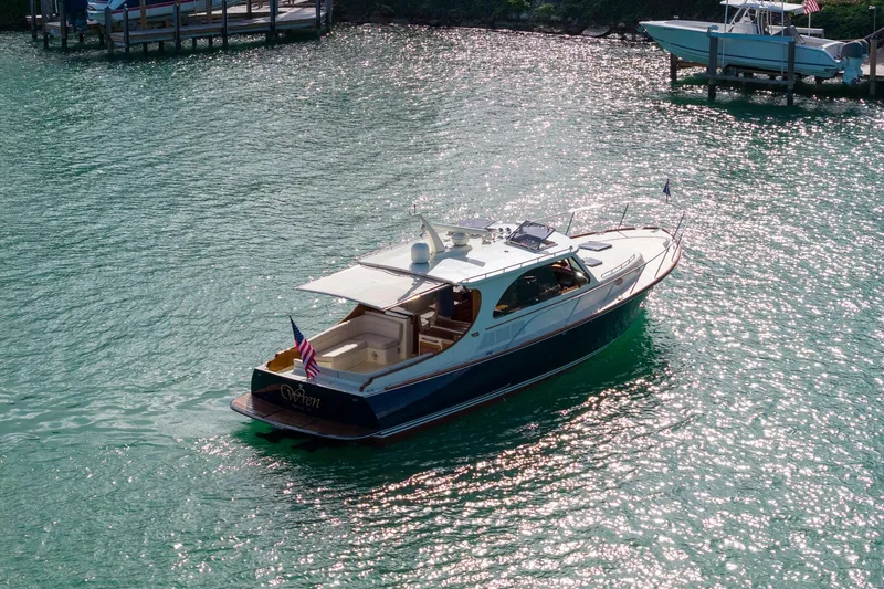 Wren Yacht Photos Pics 2015 Hinckley Talaria 43 Motoryacht cruising on sparkling water.