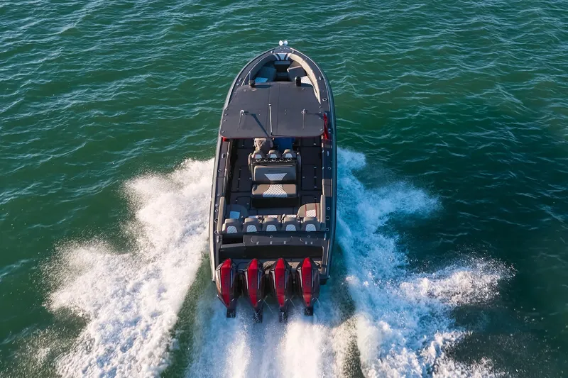  Yacht Photos Pics 2020 Midnight Express 37 Open boat cruising on open water, rear view.