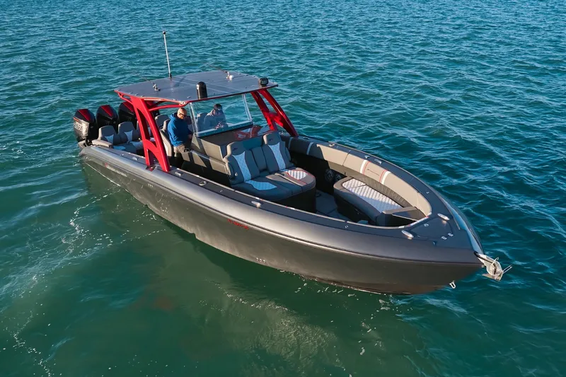  Yacht Photos Pics 2020 Midnight Express 37 Open boat cruising on clear blue water.