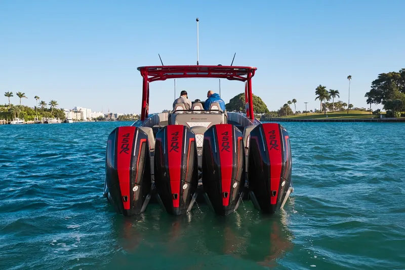  Yacht Photos Pics 2020 Midnight Express 37 Open boat with four powerful outboard engines on a sunny day.