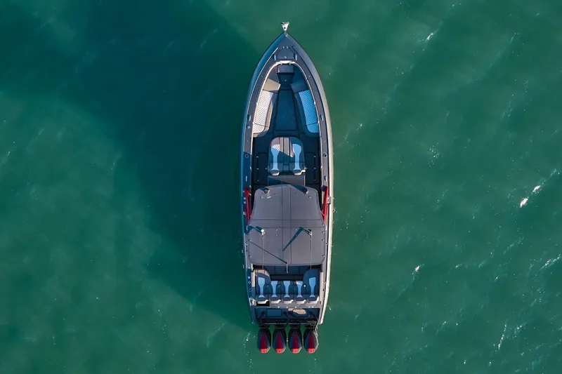  Yacht Photos Pics Aerial view of 2020 Midnight Express 37 Open boat on calm green water.