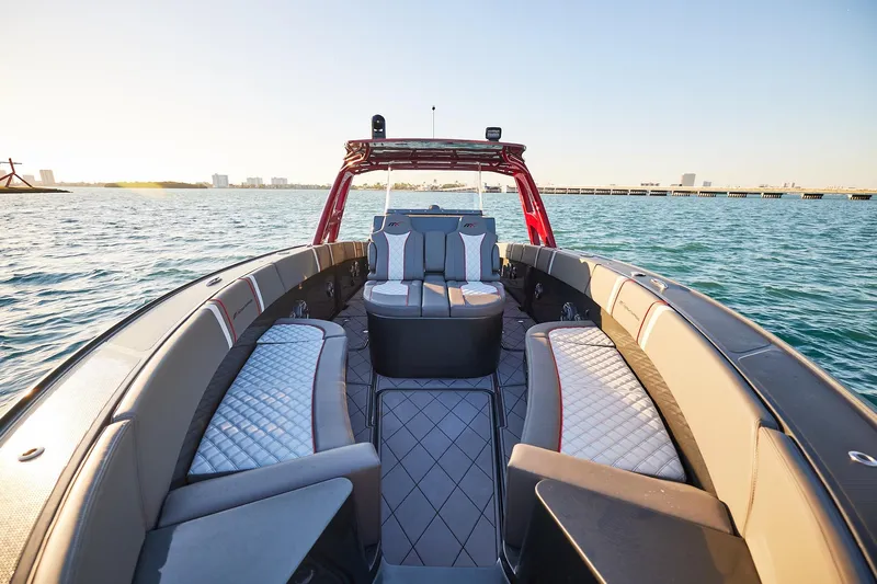  Yacht Photos Pics 2020 Midnight Express 37 Open boat interior with luxurious seating on calm water.