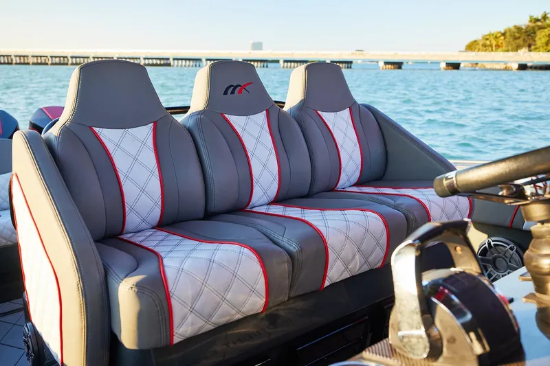  Yacht Photos Pics Luxury seating on 2020 Midnight Express 37 Open boat, featuring stylish gray and red upholstery.