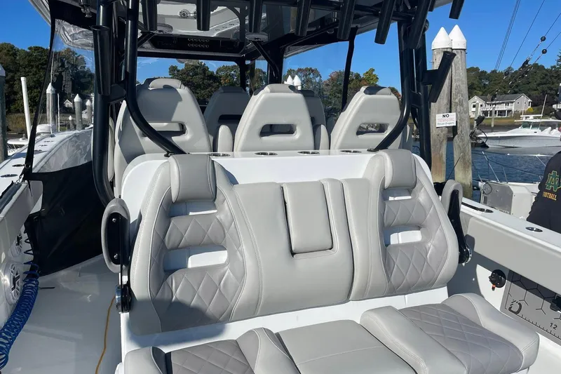  Yacht Photos Pics Luxury seating on a 2024 Freeman 42LR boat, featuring sleek design and premium materials.