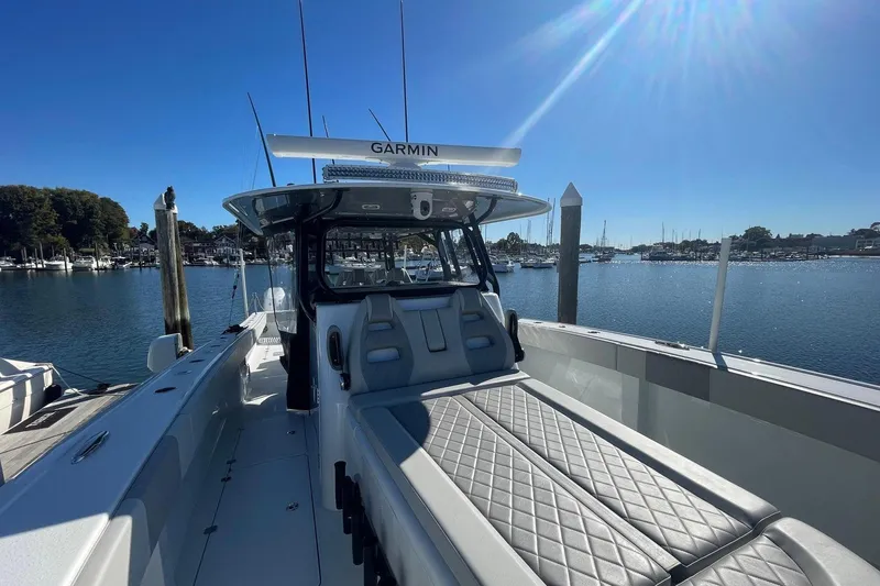  Yacht Photos Pics 2024 Freeman 42LR boat docked, featuring sleek design and advanced Garmin navigation system.