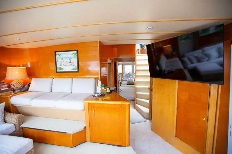 Painkiller Yacht Photos Pics Luxurious interior of 1999 Tarrab Motor Yacht with cozy seating and modern decor.