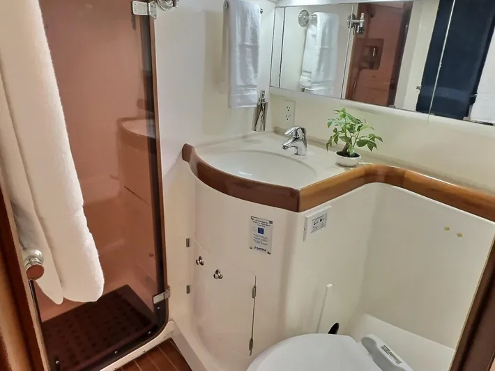 Celebrate Yacht Photos Pics Luxurious bathroom in 2003 Taswell 58 yacht with modern fixtures and elegant design.