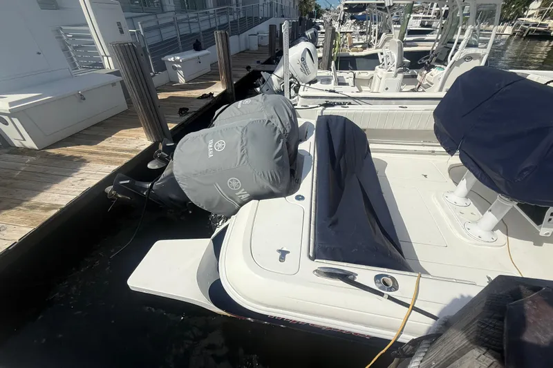  Yacht Photos Pics 2013 Intrepid 327 Cuddy boat docked, featuring Yamaha engine covers.