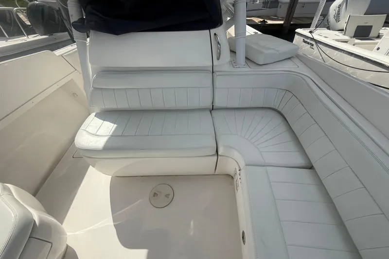  Yacht Photos Pics 2013 Intrepid 327 Cuddy boat interior with white cushioned seating.