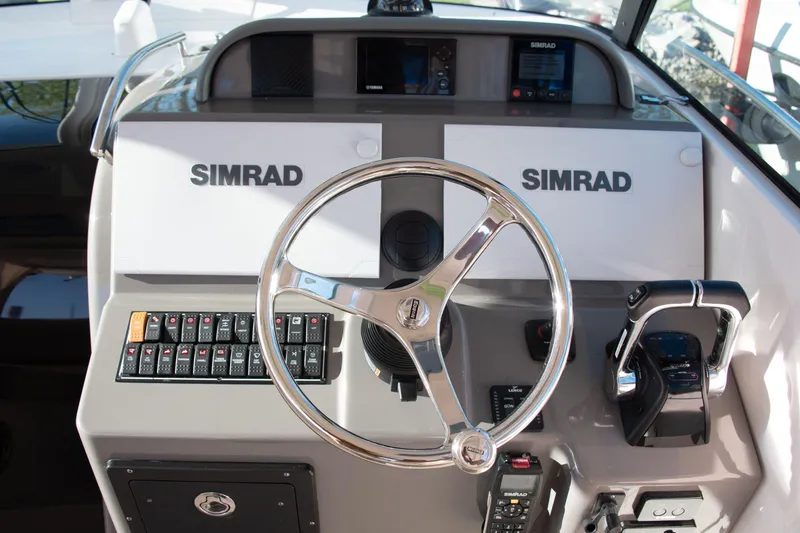 Yacht Photos Pics Control panel of 2015 Pursuit OS 345 Offshore boat with Simrad navigation system.