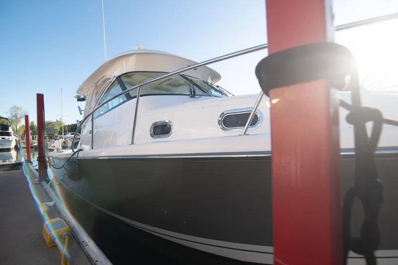  Yacht Photos Pics 2015 Pursuit OS 345 Offshore boat docked in marina, sunny day.