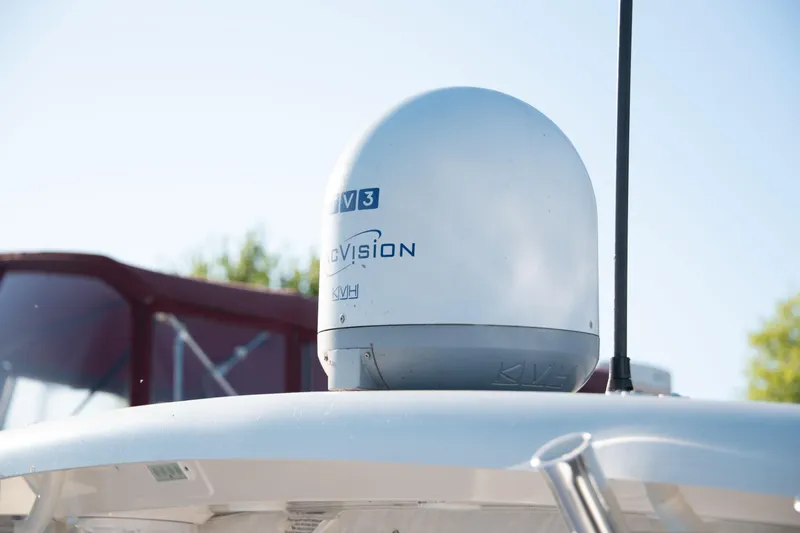  Yacht Photos Pics Satellite dome on 2015 Pursuit OS 345 Offshore boat under clear sky.