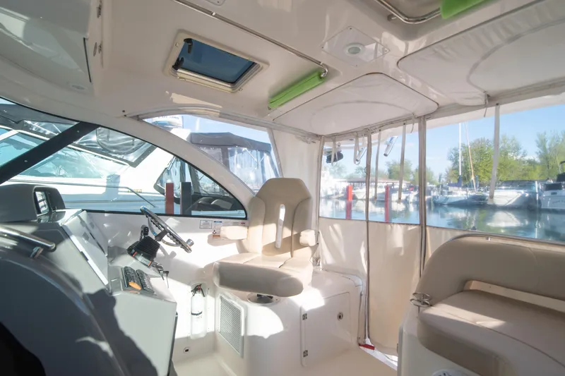  Yacht Photos Pics Interior of 2015 Pursuit OS 345 Offshore boat with helm and seating area.