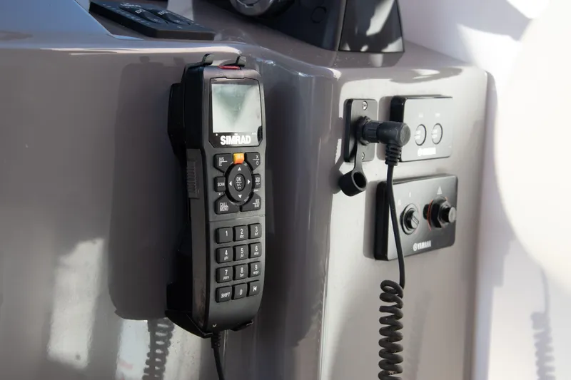  Yacht Photos Pics Simrad marine radio on 2015 Pursuit OS 345 Offshore boat dashboard.