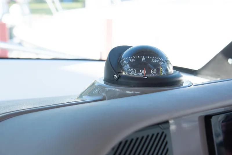  Yacht Photos Pics Compass on 2015 Pursuit OS 345 Offshore boat dashboard, close-up view.