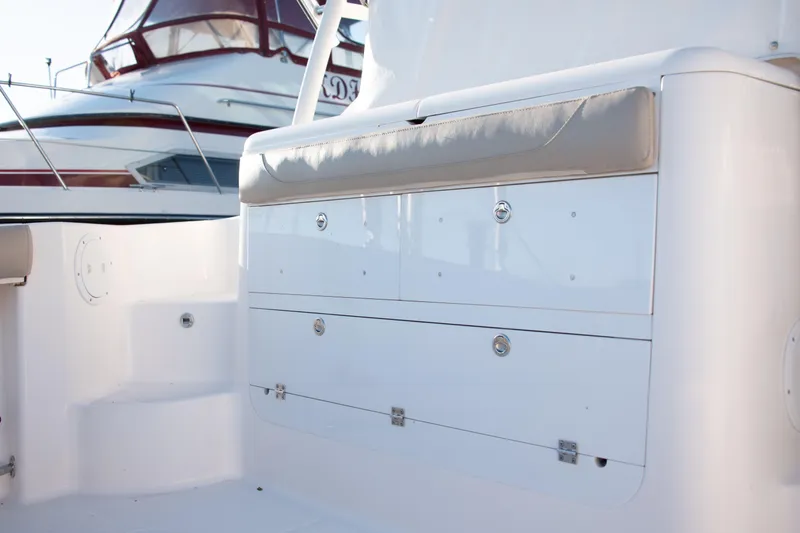  Yacht Photos Pics 2015 Pursuit OS 345 Offshore boat interior with storage compartments and seating.