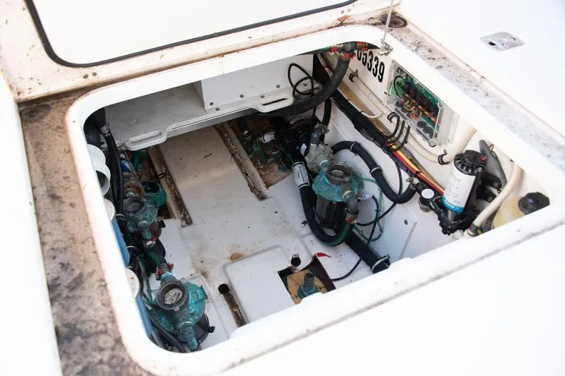  Yacht Photos Pics Engine compartment of a 2015 Pursuit OS 345 Offshore boat, showing mechanical components.