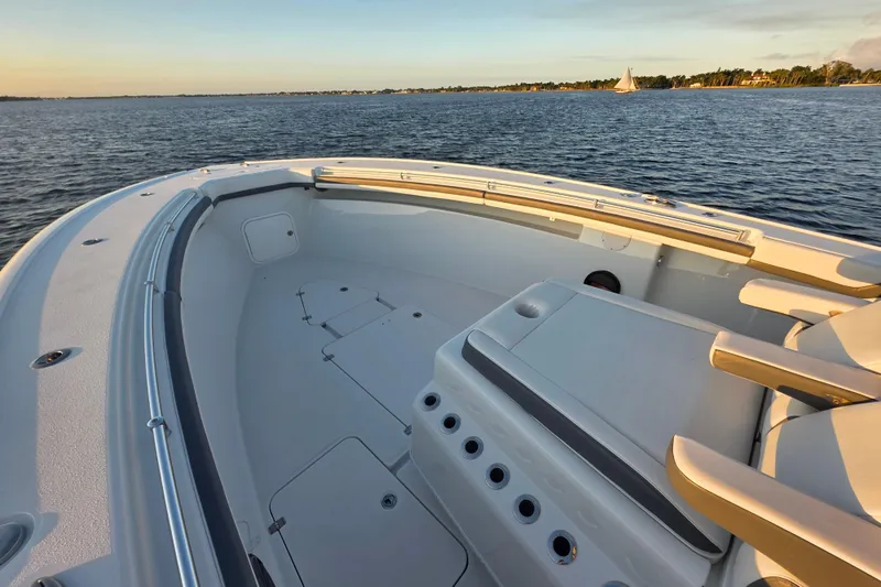 T/t One More Day Yacht Photos Pics 2019 Yellowfin 42 Offshore boat deck with ocean view at sunset.