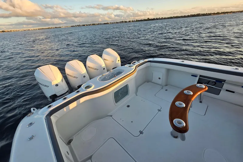 T/t One More Day Yacht Photos Pics 2019 Yellowfin 42 Offshore boat with four Mercury engines on calm water.