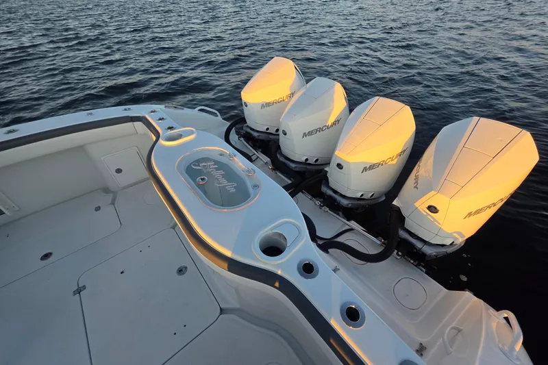 T/t One More Day Yacht Photos Pics 2019 Yellowfin 42 Offshore boat with four Mercury outboard engines on the water.